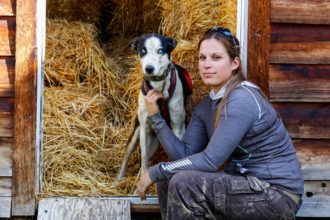 Musher Morgan Larson with her dogs