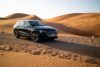 Svart Audi bland sanddynerna
